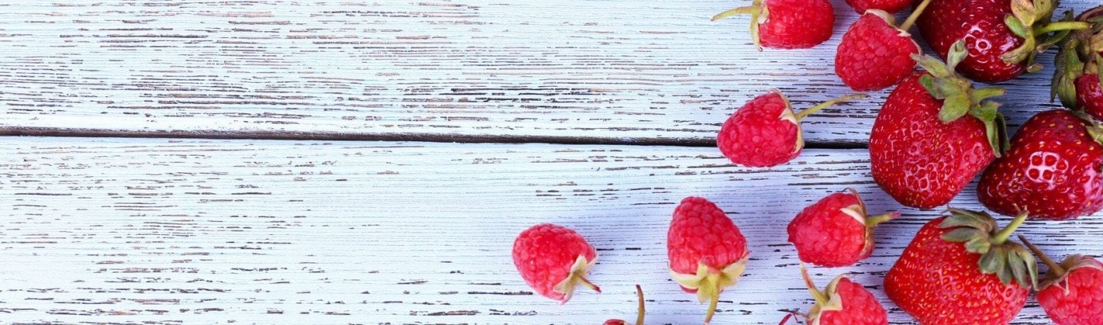Different berries on wooden table close-up